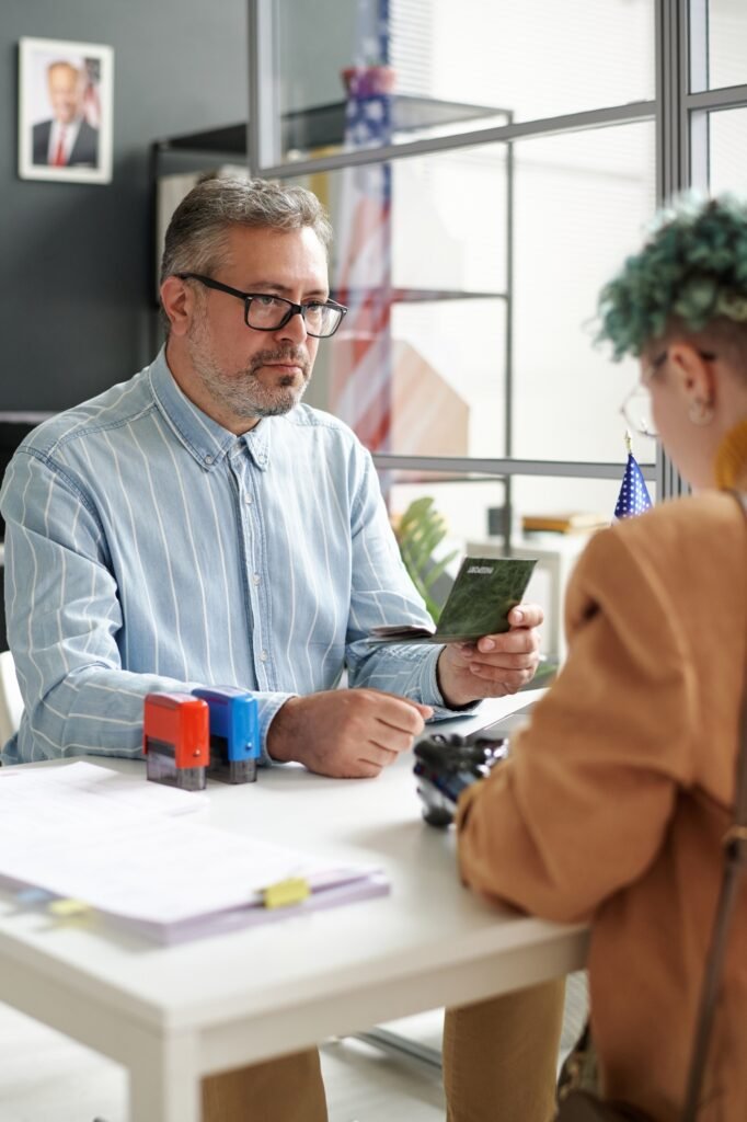 Manager of visa center working with client